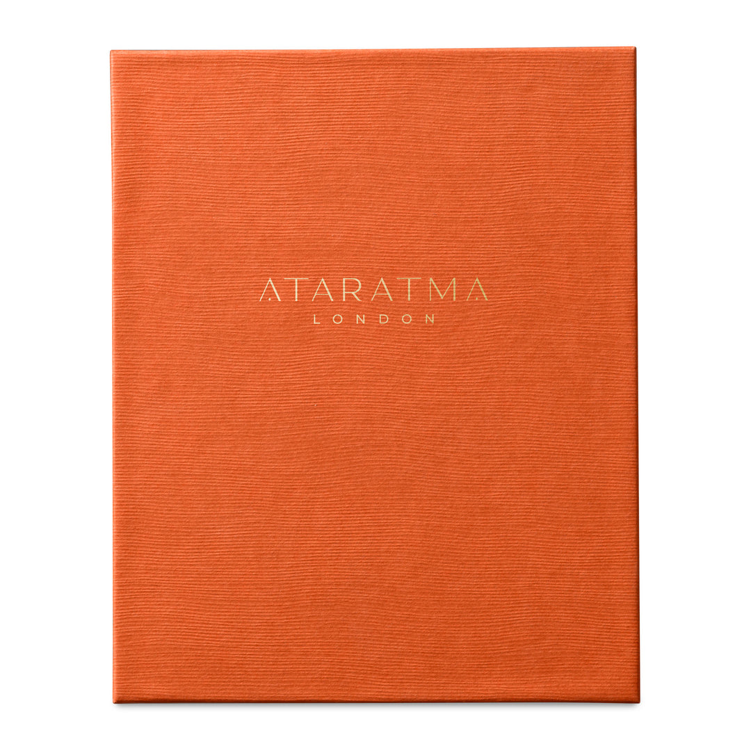Orange perfume box with 'Ataratma London' branding on a white background