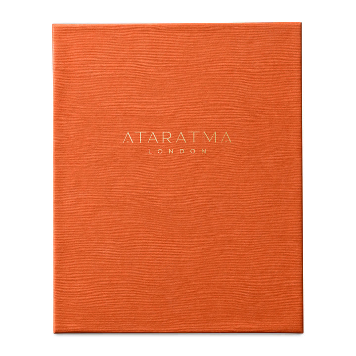 Orange perfume box with 'Ataratma London' branding on a white background